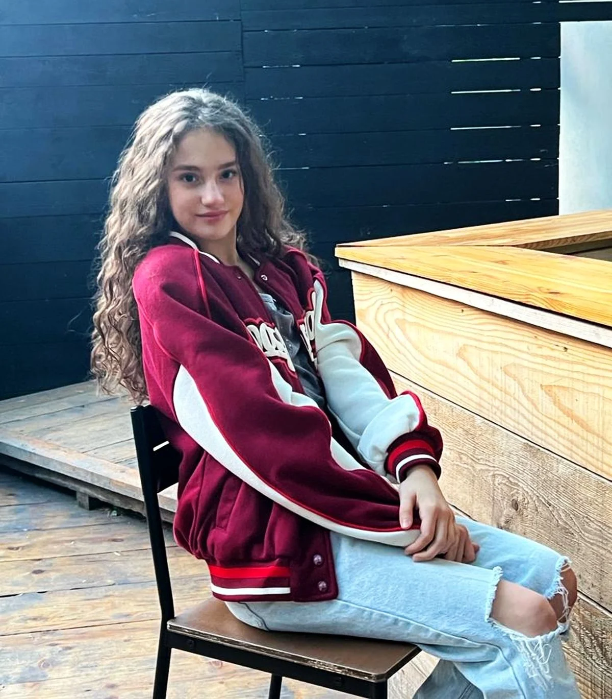 Amalia Lică as a teenager wearing a varsity jacket Amalia Lică as a teenager wearing a varsity jacket